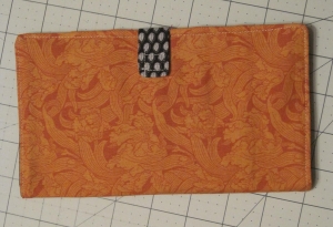 First attempt, outside, orange fabric.