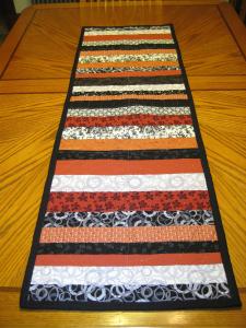 Red black and white reverse side of table runner